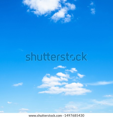 several light cumuli clouds in blue sky on sunny august day Royalty-Free Stock Photo #1497685430