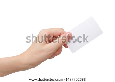Female hand holding blank paper business card isolated on white Royalty-Free Stock Photo #1497702398