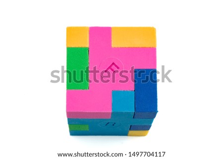Cube puzzle of multi-colored rubber shapes. Concept of decision making process, creative, logical thinking. Logical tasks. Conundrum, find the missing piece of the proposed.