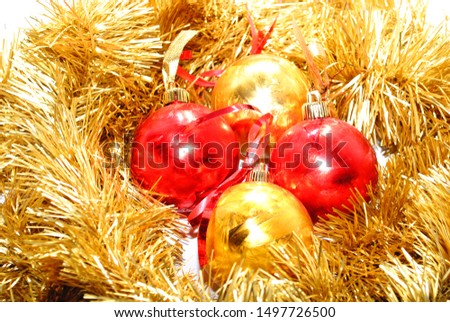 Christmas decorations, gold and red balls in a garland