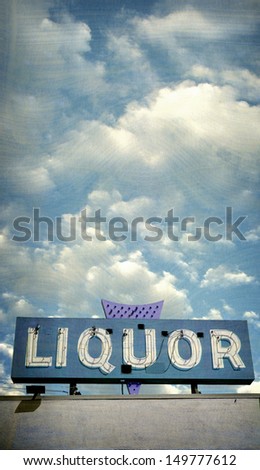 aged and worn vintage photo of liquor sign                               