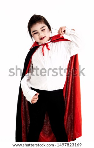 Little asian girl in halloween Scary Dracula costume on white background