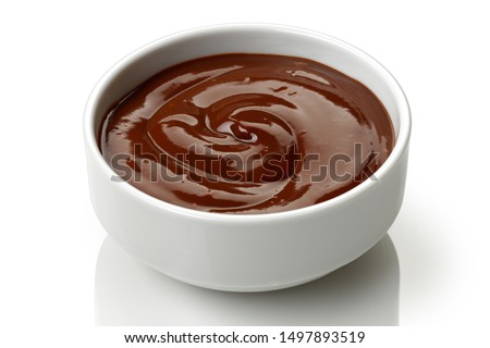 Chocolate pudding in a bowl isolated on white background