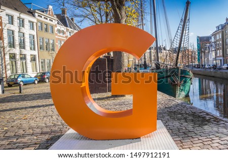 Big orange letter G in the historic center of Groningen, Netherlands Royalty-Free Stock Photo #1497912191