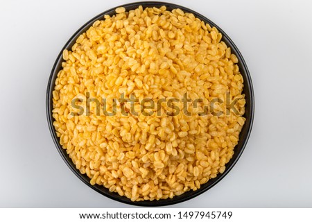 Traditional Indian deep-fried moong dal namkeen - The mung bean, alternatively known as the green gram, maash, or moong Royalty-Free Stock Photo #1497945749