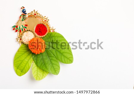 Happy Dussehra greeting card , green leaf,Rice and kumkum  Royalty-Free Stock Photo #1497972866