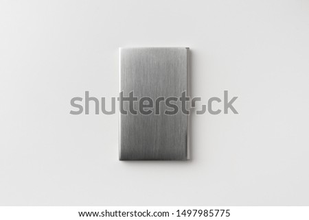 Design concept - top view of vertical business card stainless steel case isolated on white background for mockup, it's real photo, not 3D render