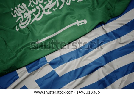 waving colorful flag of greece and national flag of saudi arabia. macro