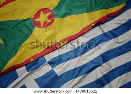 waving colorful flag of greece and national flag of grenada. macro
