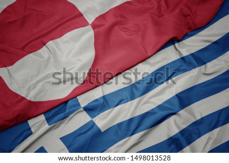 waving colorful flag of greece and national flag of greenland. macro