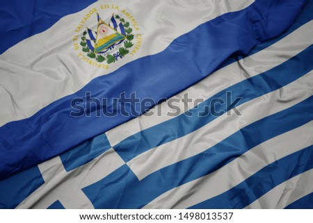 waving colorful flag of greece and national flag of el salvador. macro