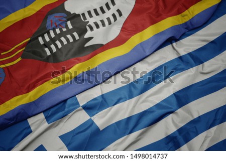waving colorful flag of greece and national flag of swaziland. macro