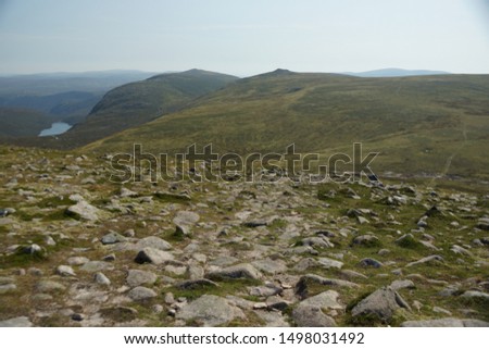 A landscape image across to Cairn Bannoch and Broad Cairn from the slopes of Carn an t-Sagairt Mor in the Scottish Highlands.  Dubh Loch can be seen left of picture.