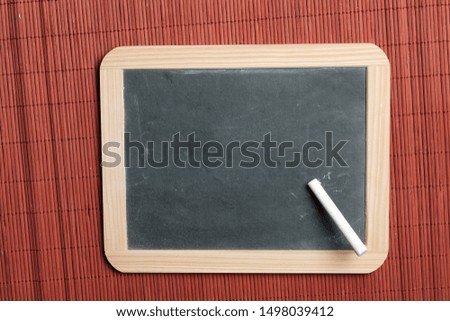 old school chalk blackboard with chalk