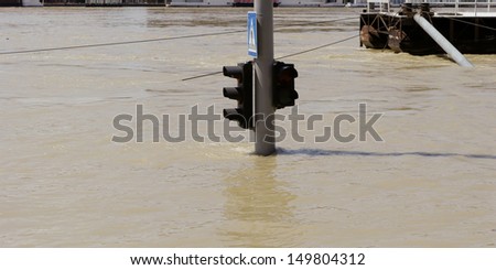 traffic light on flooding river
