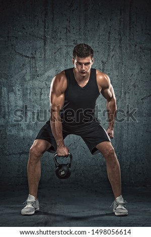 Handsome Athletic Men Exercising With Kettlebell Royalty-Free Stock Photo #1498056614
