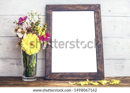 Wood frame with flowers on white background