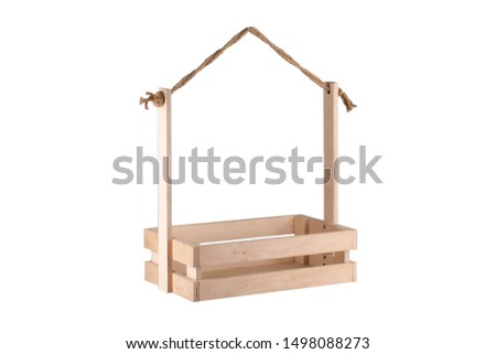 Wooden box with a rope handle on a white background. Storage box