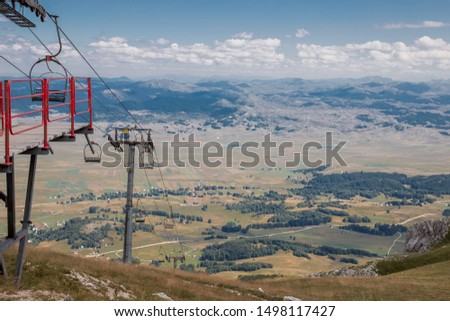 Mountain ski lift, technical structure in a mountainous area in summer.