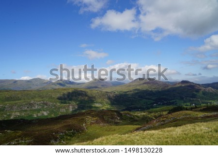 Beautiful Scenic Mountain Skyline with Clouds and Sun - Snowdonia Wales UK
