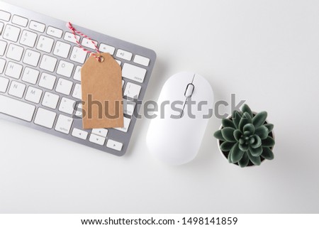 Cyber monday sale concept with sale tag on computer keyboard on white desk,  flat lay