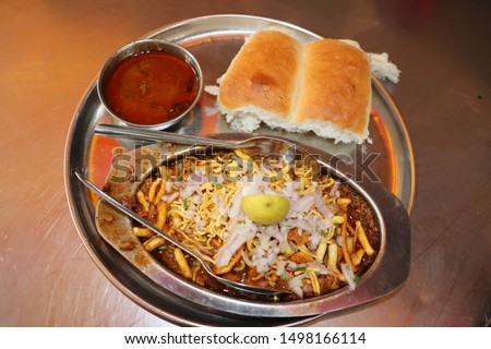 Close up view of indian  street food in Mumbai. Maharastra fast food- missal pav. Royalty-Free Stock Photo #1498166114