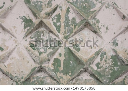 old peeled wall of white and green color
