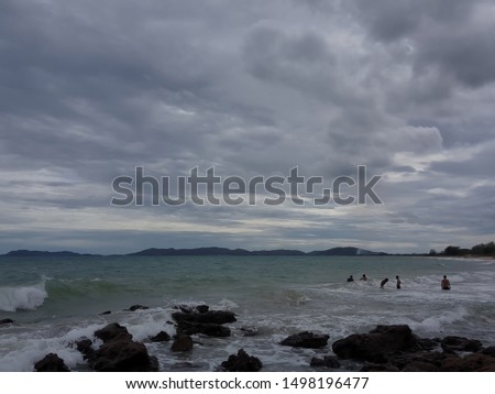 Picture of a beach on a sunny day with a stone barrier at the beach Rayong, Thailand