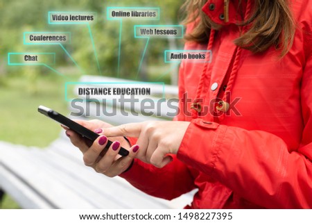 A student is using her mobile phone for distance education via internet concept.