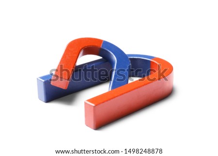 Red and blue horseshoe magnets on white background