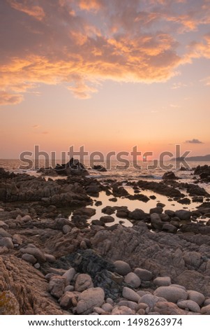 this picture was taken in the gulf of Valinco in Corsica. At the west end of the small village of Porto Pollo, there is a seal bay called La Punta. The sunsets on the rocky beach are wonderfull.