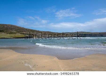 Sun and the sand on Barley Cove beach West Cork Ireland Royalty-Free Stock Photo #1498265378