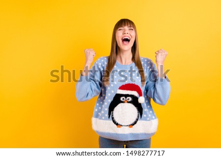  Photo of pretty rejoicing girl wearing oversize knitted with comic pattern picture pullover jumper having won super prize isolated bright color background