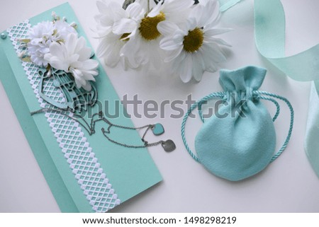 greeting card design. white daisies and an envelope on a white background.