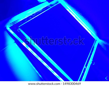 On a blue background square with led backlight.