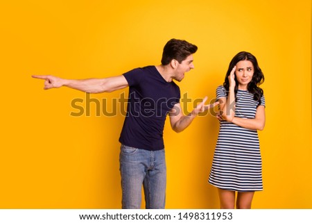 Portrait of nice attractive depressed frustrated sullen gloomy grumpy dissatisfied aggressive married spouses having argument disagreement pretense isolated on bright vivid shine yellow background