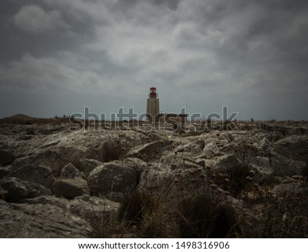 CLOUDY DAY LIGHTHOUSE ROCKS STORM