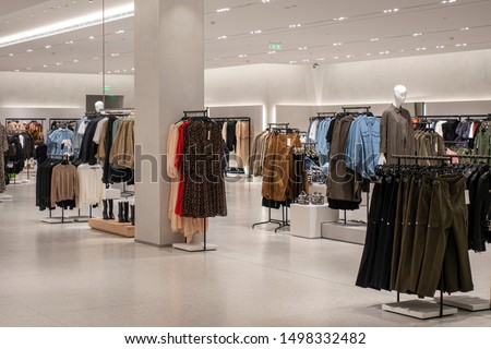 Modern fashionable brand interior of clothing store inside shopping center Royalty-Free Stock Photo #1498332482