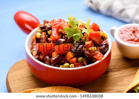 Preparation of tacos - delicious ingredients include tortilla and meat and vegetable stuffing