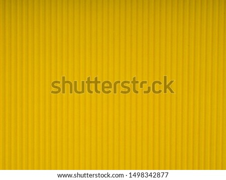 pantone Yellow corrugated cardboard carton, texture background, colorful. Yellow corrugated cardboard carton in a colorful texture background series.