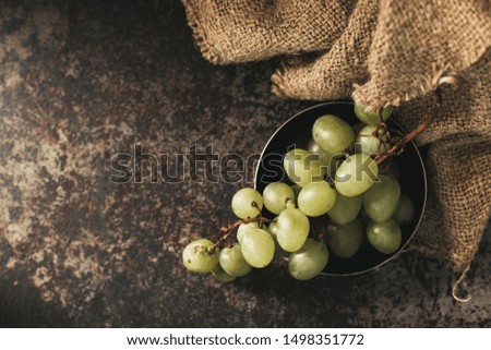 Bunch of green grapes on a dark background. Organic food.