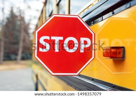 School bus outdoors close stop sign-up