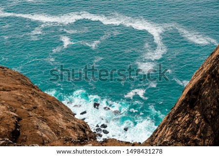 Beautiful beach with a large rocky cliff