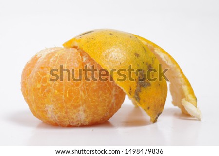 Picture of peeled orange on a isolated white background