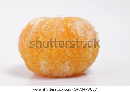 Picture of peeled orange on a isolated white background