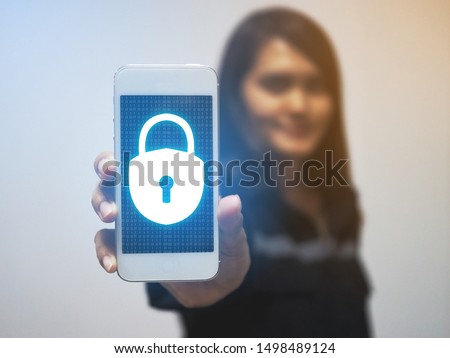 concept of cyber security, people use the smartphone with Keyhole icon and business network. data security in online network