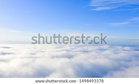 Aerial view White clouds in blue sky. Top. View from drone. Aerial bird's eye. Aerial top view cloudscape. Texture of clouds. View from above. Sunrise or sunset over clouds Royalty-Free Stock Photo #1498493378