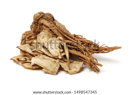 Sliced Angelica Sinensis or Dang Gui on white background Royalty-Free Stock Photo #1498547345