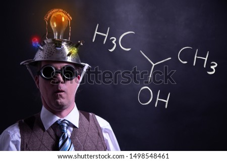 Nerd presenting handdrawn chemical formula of Isopropylalcohol isopropanol 2-propanol molecule Royalty-Free Stock Photo #1498548461
