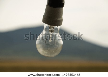 Close up image of light bulb on blurred background.